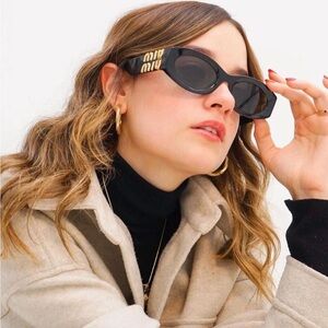 Miu Miu Black and Gold Sunglasses